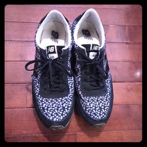 Gently worn New Balance casual sneakers.
